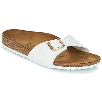 white birkenstocks with gold buckles